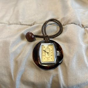 Antique brown lapel watch